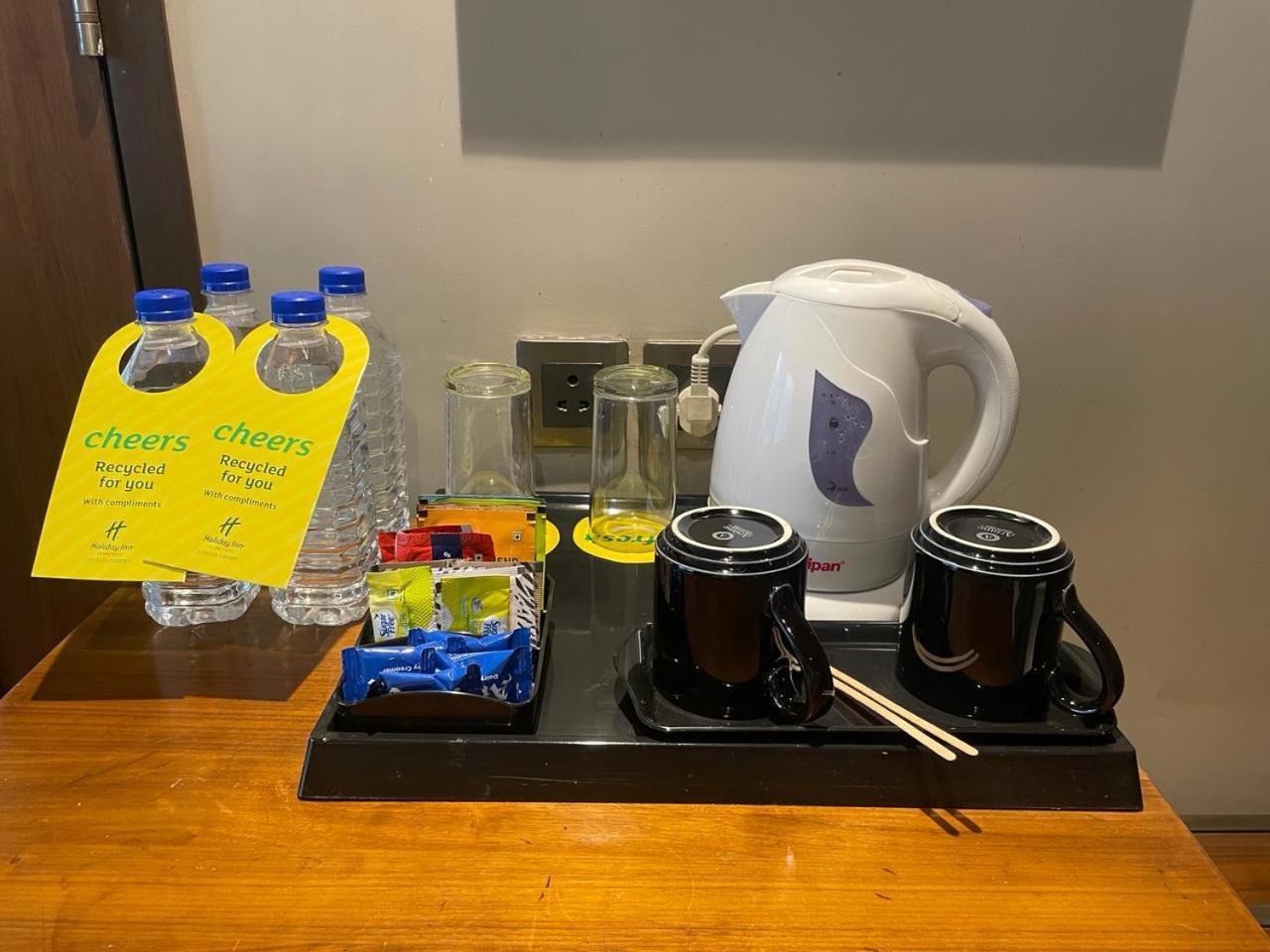 Holiday Inn Kolkata Airport By Ihg Exterior photo A kettle and bottled water in a hotel room